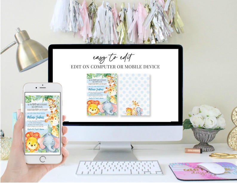 May include: A computer monitor and smartphone display a baby shower invitation design. The invitation features watercolor illustrations of jungle animals, including a lion, elephant, and giraffe. The text "easy to edit" is displayed on the monitor.