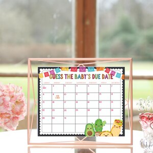 May include: A printable baby shower game with a black background and colorful Mexican-themed decorations. The game is called "Guess the Baby's Due Date" and features a calendar with the month of May. The calendar has a cute avocado, cactus, and burrito illustration.