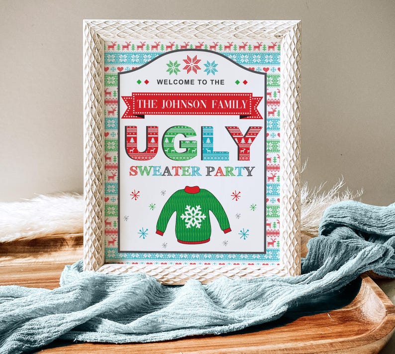 May include: A white framed sign with a red, green, and blue patterned border. The sign says "Welcome to the Johnson Family Ugly Sweater Party". The sign has a green sweater with a snowflake on it.