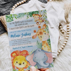 May include: A baby shower invitation with jungle animal illustrations, including a giraffe, lion, monkey, and elephant. The invitation text reads "We are wild with excitement and happy to say, a sweet baby boy is on the way!" and includes event details.