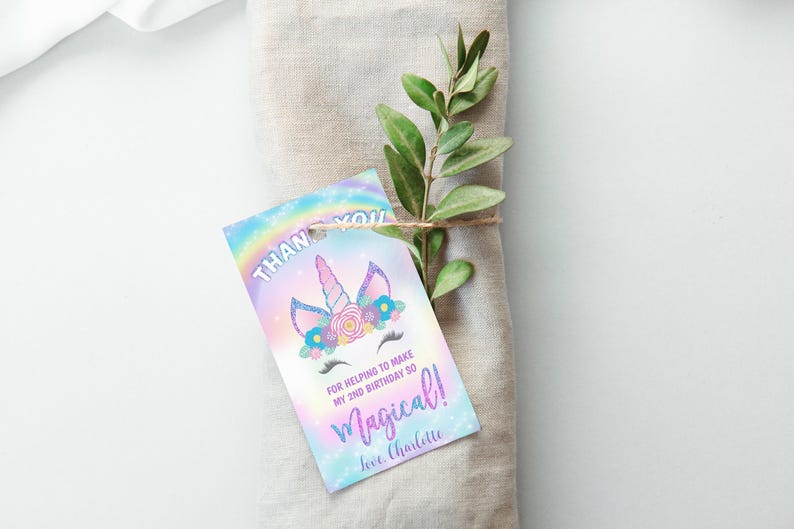May include: A thank you tag with a unicorn illustration and a rainbow background. The text reads "Thank you for helping to make my 2nd birthday so magical! Love, Charlotte".