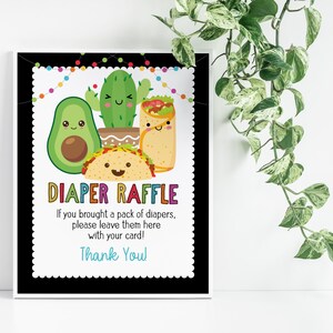 May include: A black and white sign with colorful text that says "Diaper Raffle". The sign features a cartoon avocado, cactus, and taco. The text below the title says "If you brought a pack of diapers, please leave them here with your card! Thank You!"