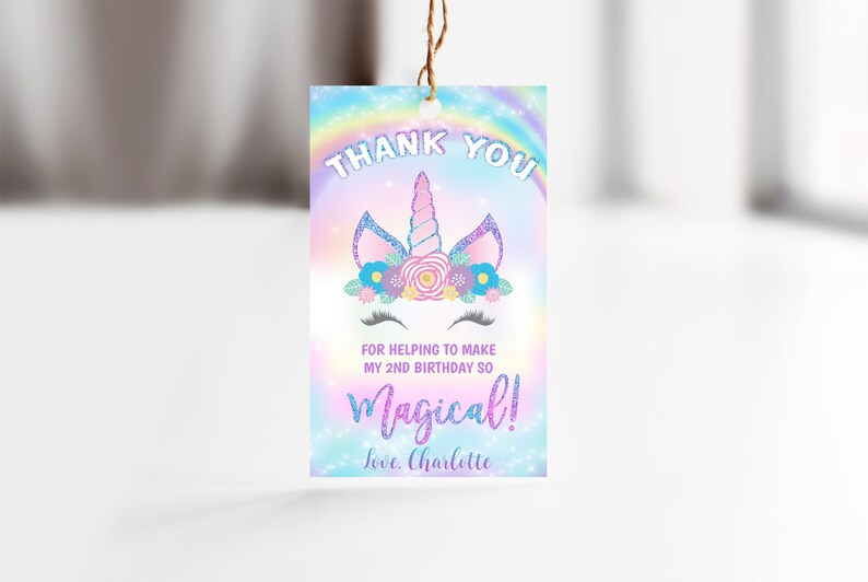 May include: A thank you tag with a unicorn illustration and rainbow background. The text reads "Thank You for helping to make my 2nd birthday so Magical! Love, Charlotte."