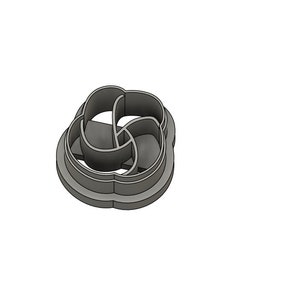 May include: A silver metal cookie cutter shaped like a four-leaf clover with a decorative design.