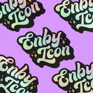 May include: Five iridescent stickers with the text "Enby Icon" in a black, white, and rainbow color scheme. The stickers have a holographic finish and feature small star accents.