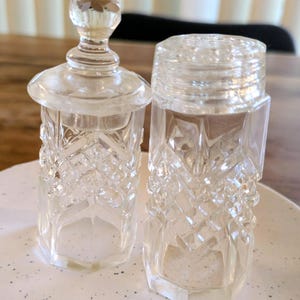 Vintage Cut Glass Salt shaker and pepper pot with lid.