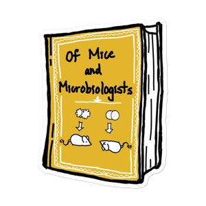 May include: A yellow book with a black border and white text that reads "Of Mice and Microbiologists". The book has a cartoon illustration of two mice with arrows pointing down to them from two symbols above. The symbols are a cluster of stars and two circles.