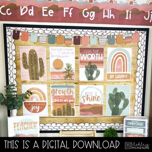 May include: A classroom bulletin board decorated with a desert theme. The board features posters with motivational quotes, cactus illustrations, and rainbow designs. The posters include phrases like "Know Your Worth", "Be Happy", "Growth is Tough", and "Rise & Shine".