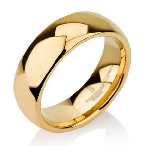 May include: A gold-coloured wedding band with a smooth, polished finish. The band is made of tungsten carbide and has a subtle sheen.