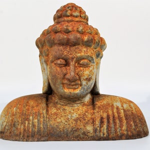 Rust Patina Buddha Statue with a serene expression on his face