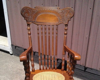 Vintage Mahogany Rocking Chair Pressed Gargoyle Busts Cane Seat