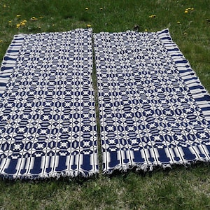 May include: A handmade wooden sign with the text "Welcome to our home" in a handwritten style. The sign is painted white with black lettering and a distressed finish, perfect for home decor.