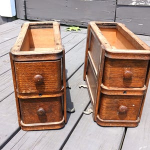 May include: A set of three ceramic mugs with a speckled, matte finish. Each mug features a different color: light blue, cream, and gray. The mugs have a simple, modern design and a comfortable handle.