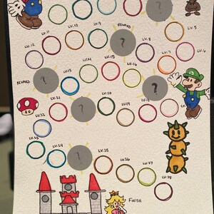 May include: A hand-drawn game board featuring a Mario-themed game with a path of circles in different colors. The game board includes a start and finish, and the path is marked with levels. The game board is decorated with characters from the Mario video game series, including Mario, Luigi, Peach, and a Goomba.