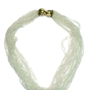 Vintage 24 Strand Pale Green Beaded Necklace with Gold Tone and Green Glass Hook Clasp. image 1