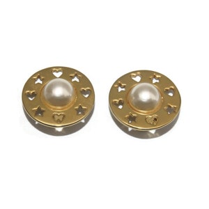 Vintage Gold Tone and Faux Pearls Round Clip on Earrings with Cot Out Stars and Hearts.