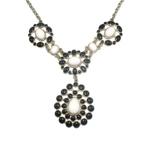 Vintage Gold Tone, Black and White Plastic 18 Inch Bib Necklace with Lobster Claw Clasp.