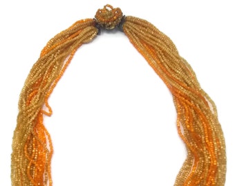 Vintage Gold Tone Orange and Yellow Orange Glass Beaded 24 Strand Necklace.