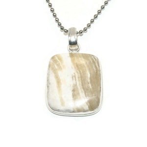 May include: A silver chain necklace with a pendant featuring a rectangular, light brown and white agate stone.