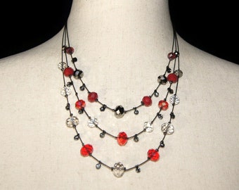 Vintage Gunmetal Tone 18 Inch 3-Strand Tiered Necklace with Red, Black, Clear and Silver Tone Glass Beads with Lobster Claw Clasp.