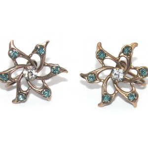 Vintage Copper Tone Flower Screw Back Earrings with Clear and Blue Rhinestones.