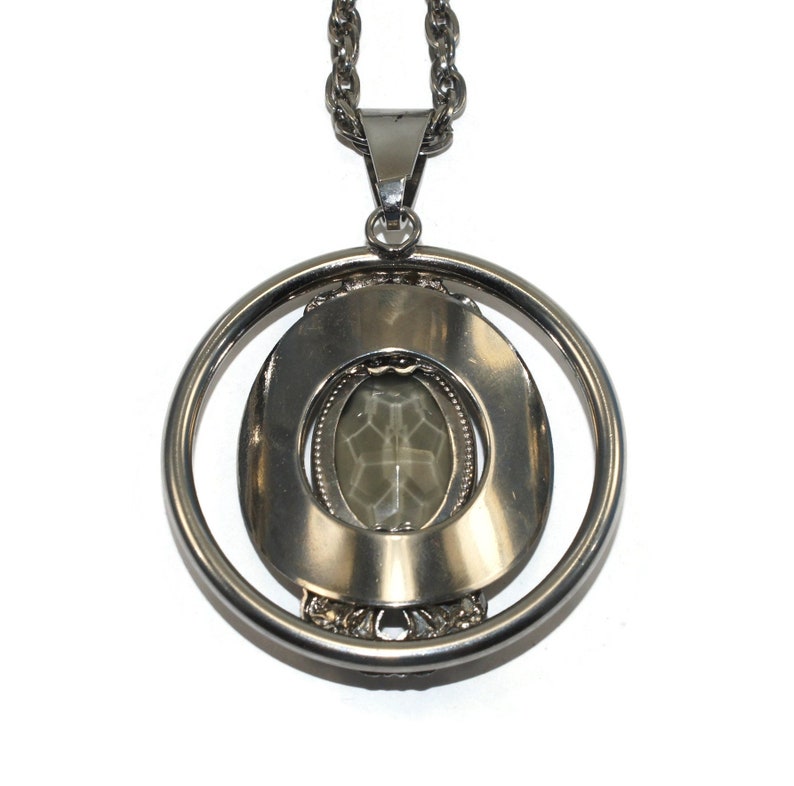 Vintage Southwestern Style Round Silver Tone Pendant with Faceted Faux Smoky Topaz on 24 Inch Silver Tone Chain with Spring Ring Clasp.
