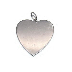 Vintage 1940s/1950s Coro Silver Tone Heart Pendant.
