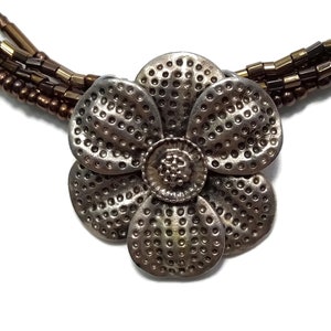 Vintage Silver Tone Flower Slide Pendant on 5 Strand Glass Beaded Necklace with Lobster Claw Clasp.