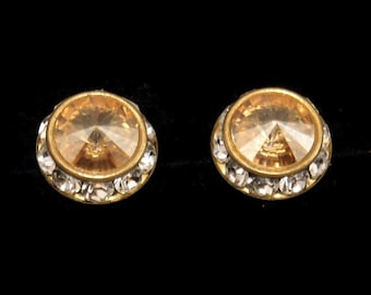 Vintage Gold Tone, Orange and Clear Rhinestones Halo Stud Earrings with Post Backs for Pierced Ears.