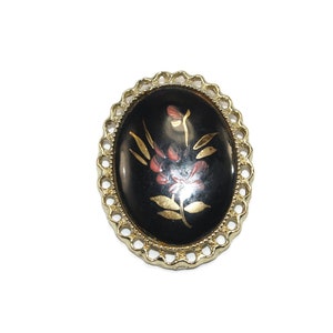 Vintage Gold Tone and Black Plastic Oval Brooch Pendant with Painted Floral Design.