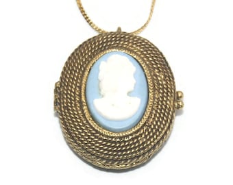 Vintage Mary Chess Oval Gold Tone, White and Blue Cameo Solid Perfume Locket Pendant on 24 Inch Gold Tone Chain with Spring Ring Clasp.