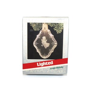 1989 Hallmark Keepsake Magic Lighted Angel Christmas Ornament. New in Original Box.