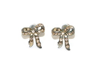 Small Vintage Silver Tone and Rhinestone Bow Stud Earrings with Post Backs for Pierced Ears.