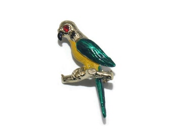Vintage Gold Tone Parrot on a Branch Brooch with Yellow, Red and Green Enamel.