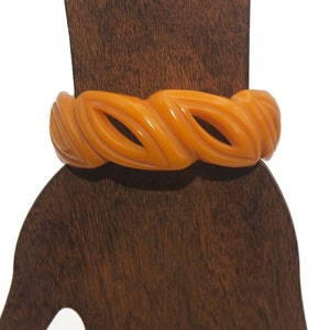 Vintage Butterscotch Bakelite Carved Cut Out 8 Inch Bangle Bracelet.