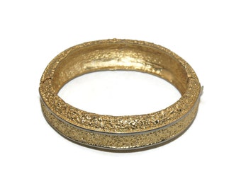 Vintage Textured Gold Tone 7 Inch Hinged Bangle Bracelet with Slide Lock Clasp.