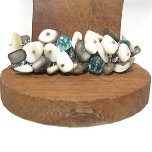 Vintage Silver Tone y Mother of Pearl Twist-O-Flex Style Stretch Bracelet. Marca JFSK Made in Japan Hallmark.