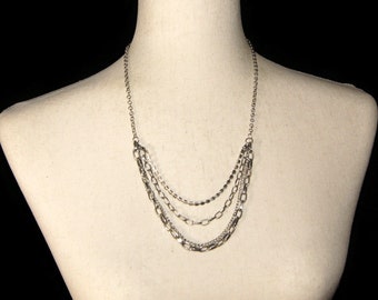 Vintage Silver Tone Tiered 4 Strand 24 Inch Necklace with Lobster Claw Clasp.