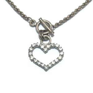 Vintage Silver Tone and Clear Rhinestones Heart Pendant on 16 Inch Silver Tone Chain with Toggle Clasp.