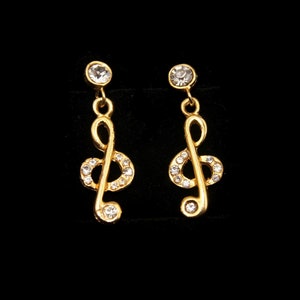 Vintage Gold Tone and Clear Rhinestones Treble Clef Music Dangle Earrings with Post Backs for Pierced Ears.