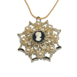 Vintage Gold Tone, Faux Pearls and Clear Rhinestones Cameo Pendant on 18 Inch Gold Tone Chain with Lobster Claw Clasp.