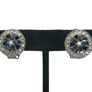 Vintage Silver Tone Round Clip on Earrings with Clear and Blue Rhinestones.