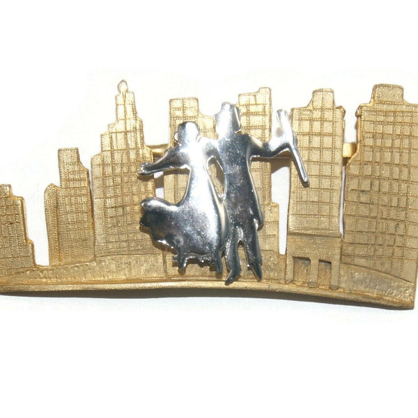 Vintage Ultra Gold Tone Skyline brooch with Silver Tone Dancing Couple. Ultra Hallmark.