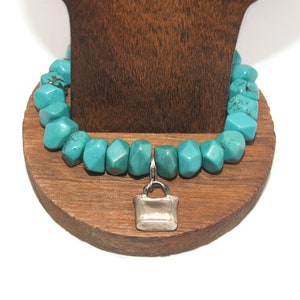 Vintage Coldwater Creek Faux Turquoise 7 Inch Beaded Bracelet with Sterling Silver Purse Charm. Marked 925 Coldwater Creek.