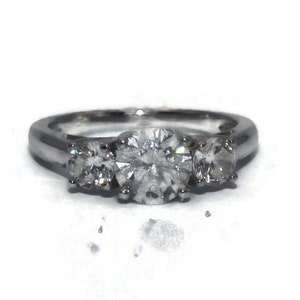 Vintage Sterling Silver and CZS 3 Stone Size 5 1/4 Engagement Ring. Marked China CZ 925.