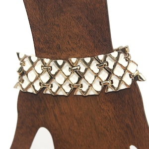 Vintage Coro Gold Tone and White Enamel 7 1/2 Inch Link Bracelet with Hinged Clip Clasp and Safety Chain. Coro Hallmark.