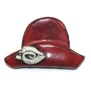 Vintage Red and Black Glazed Ceramic Hat with White Flower Brooch.