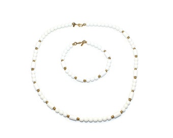 Vintage Monet Gold Tone and White Plastic Beaded 19 Inch Necklace with Matching 7 1/2 Inch Bracelet with Claw Clasps. Monet Hallmark Tags.