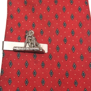 Vintage Sarah Coventry Huckleberry Finn Inspired Tie Clip Silver Tone, with Boy Dog Raft Design.
