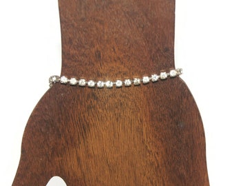 Vintage Gold Tone and Clear Rhinestones 7 Inch Tennis Bracelet with Hinged Clip Clasp.